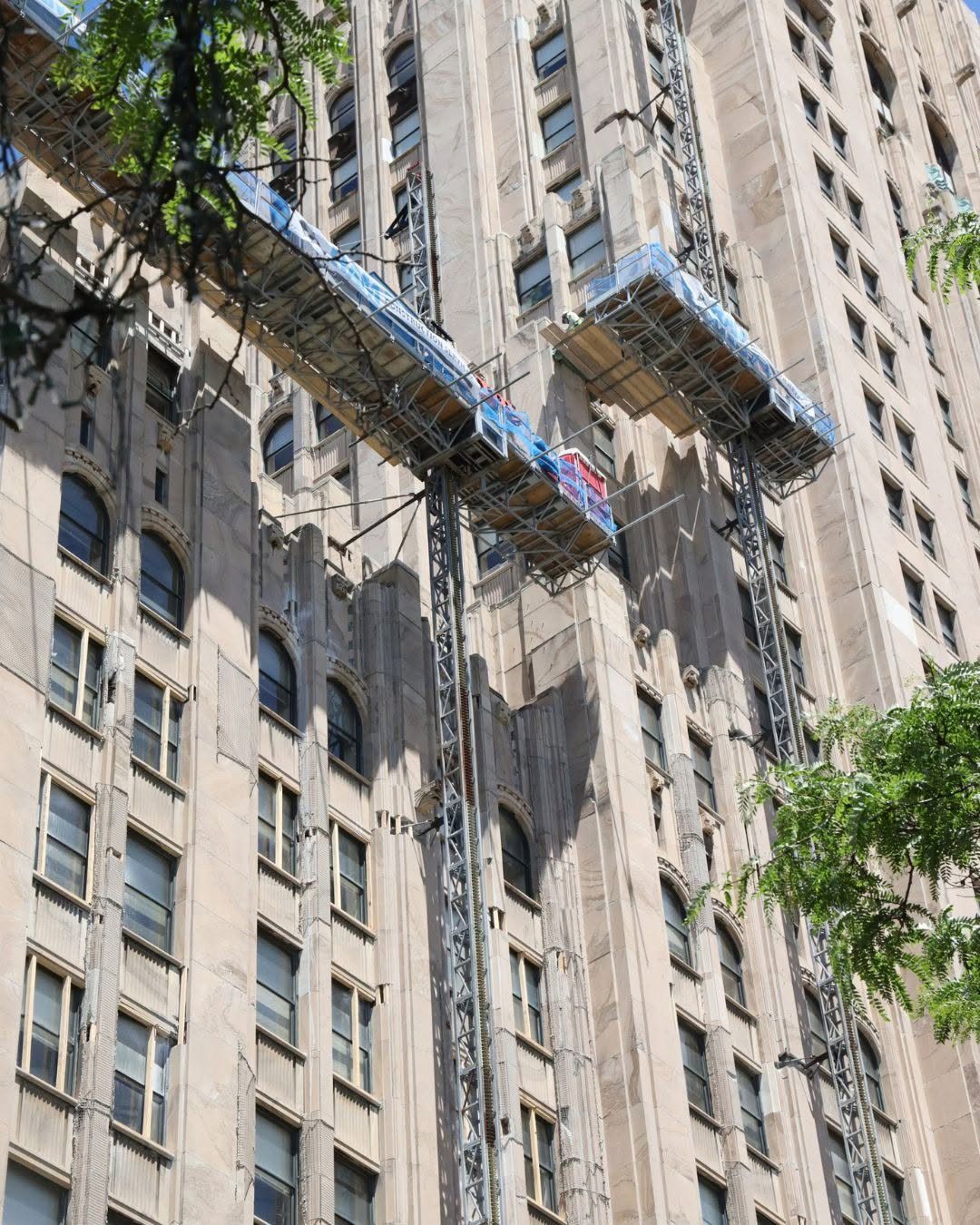 Full-height scaffolding on the Fisher Building’s marble facade